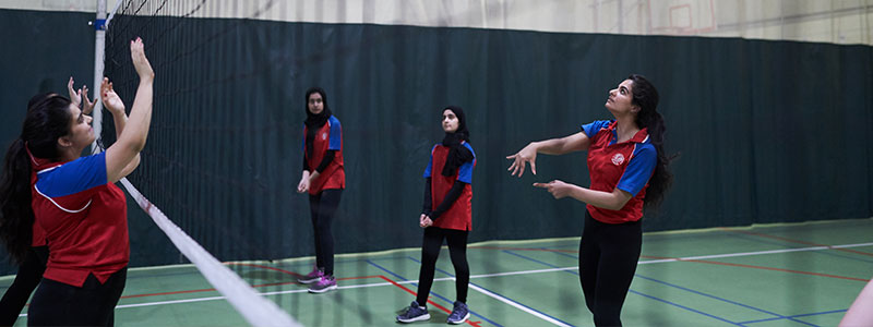 girls playing vollyball